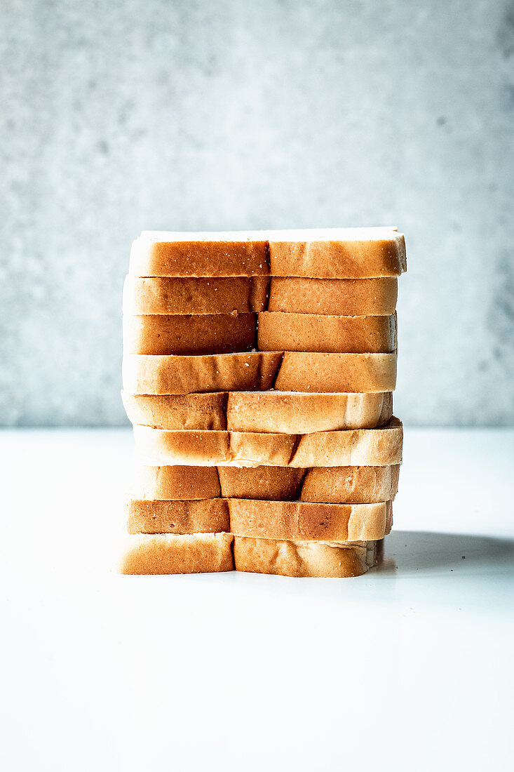 Slices of white sliced bread, stacked