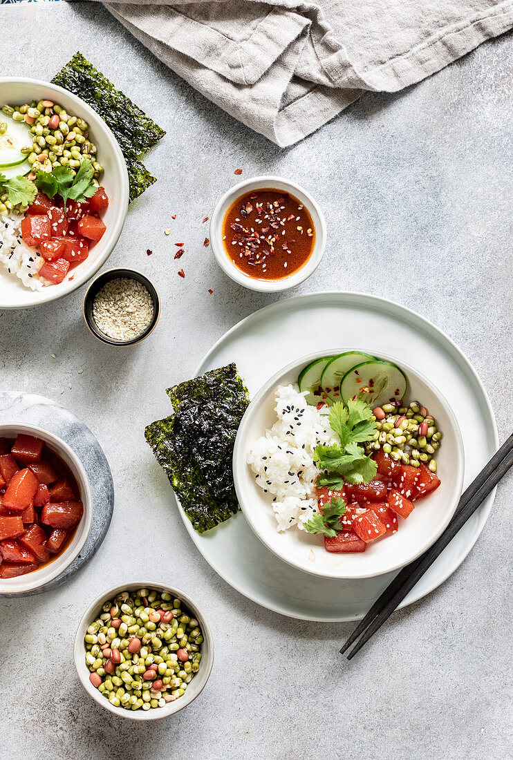 Sauteed watermelon poke bowl served with rice, cucumbers, and sprouted adzuki, lentil and beans