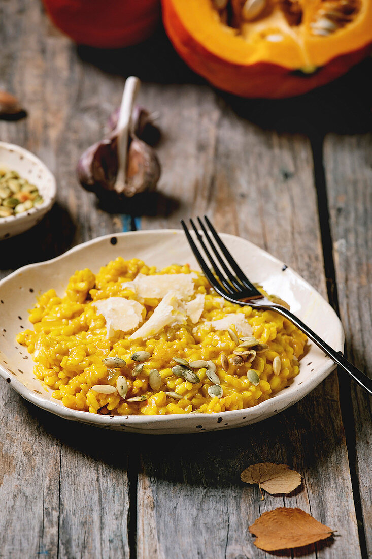 Traditional vegetarian pumpkin risotto italian dish in ceramic plate