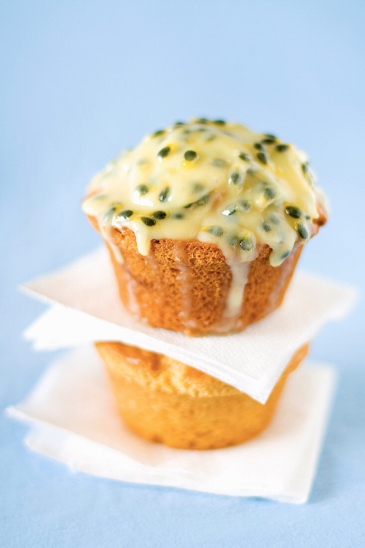 Two glazed passionfruit muffins