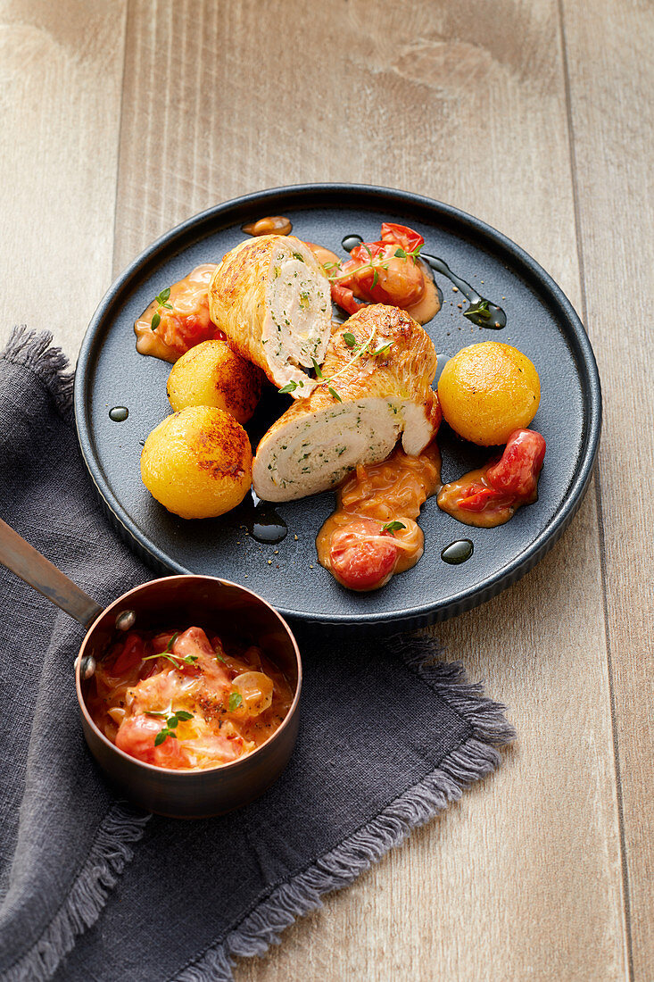 Turkey roulade with potato dumplings and cherry tomatoes