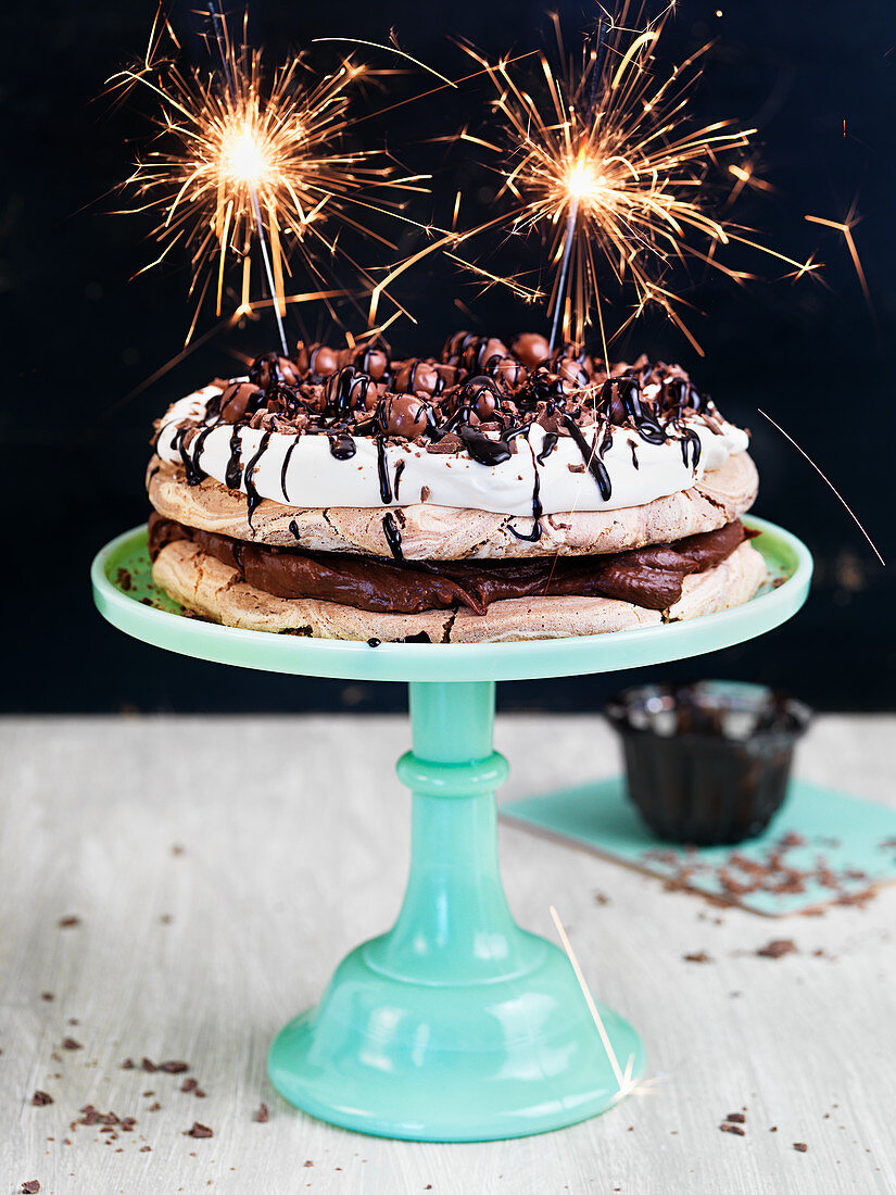 Chocolate meringue cake decorated with sparklers