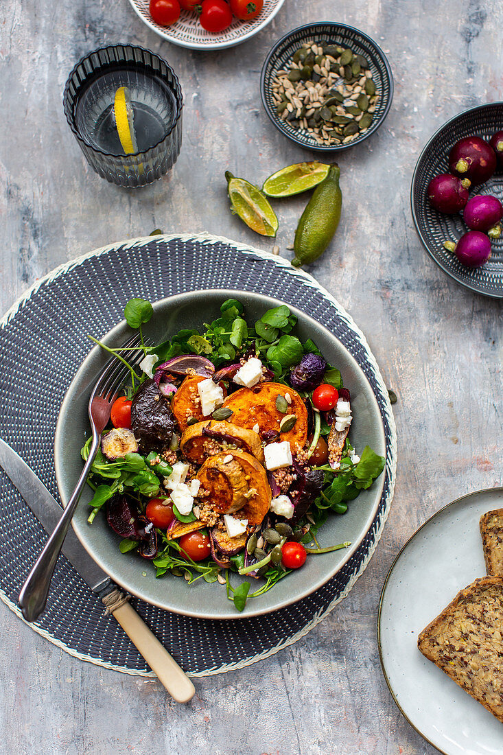 Watercress salad with beetroot, sweet potatoes, tomatoes and feta