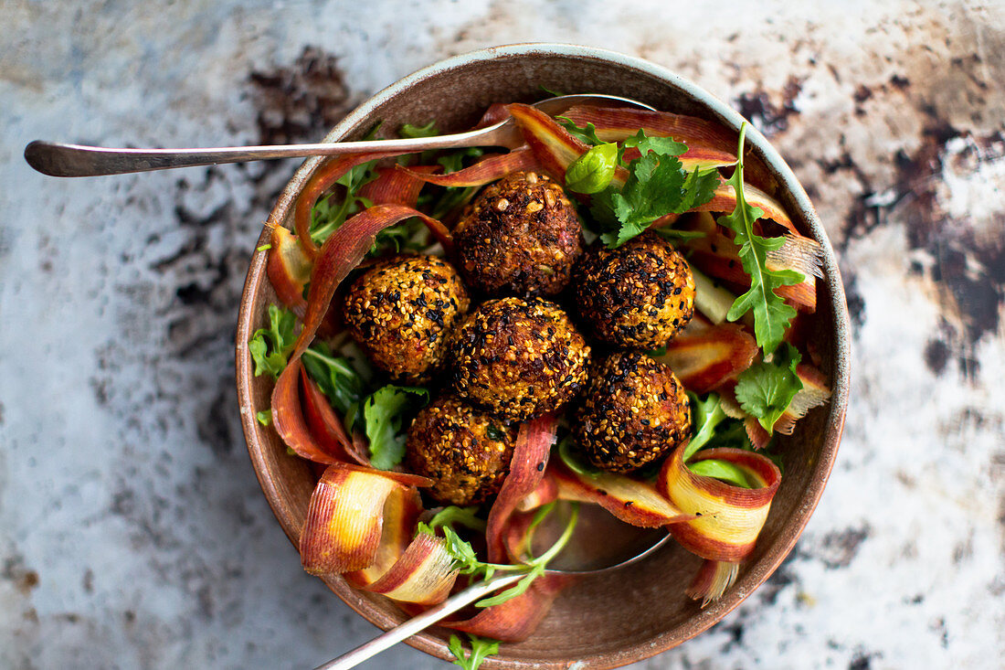 Falafel on carrot strips and rocket