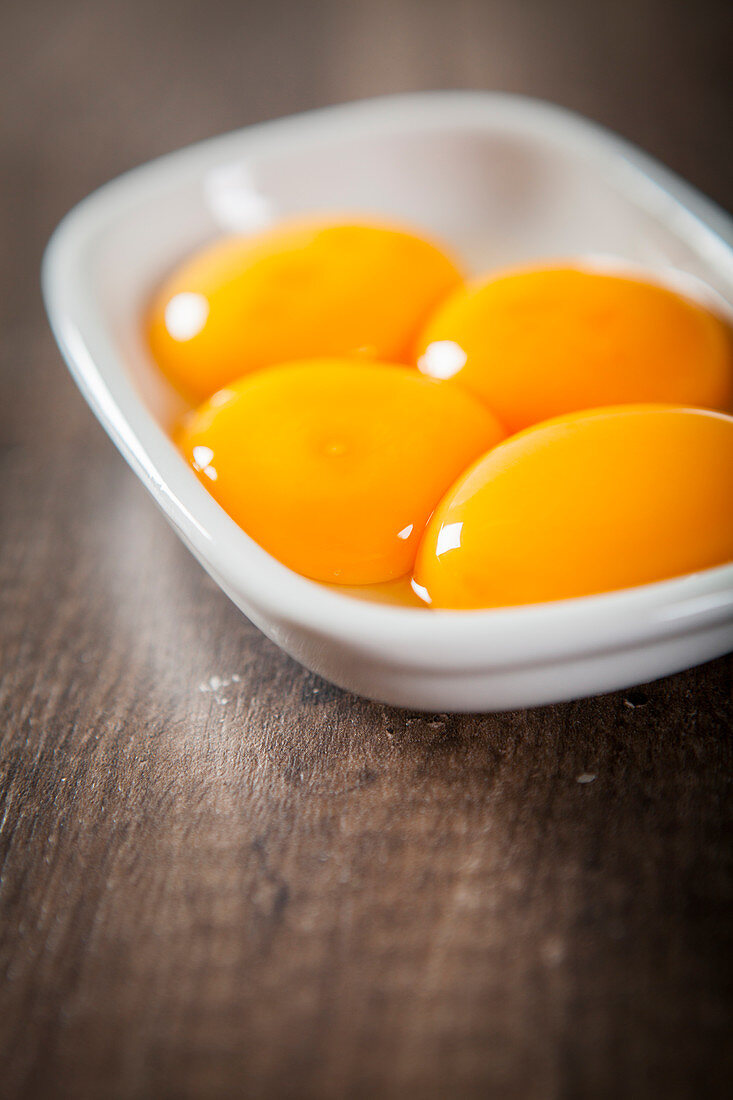 Egg yolks in a ceramic bowl