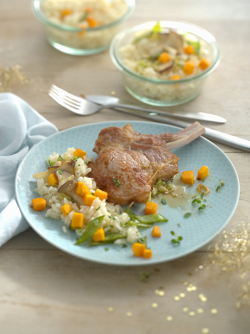 Stuffed veal chops with risotto and herb mushrooms