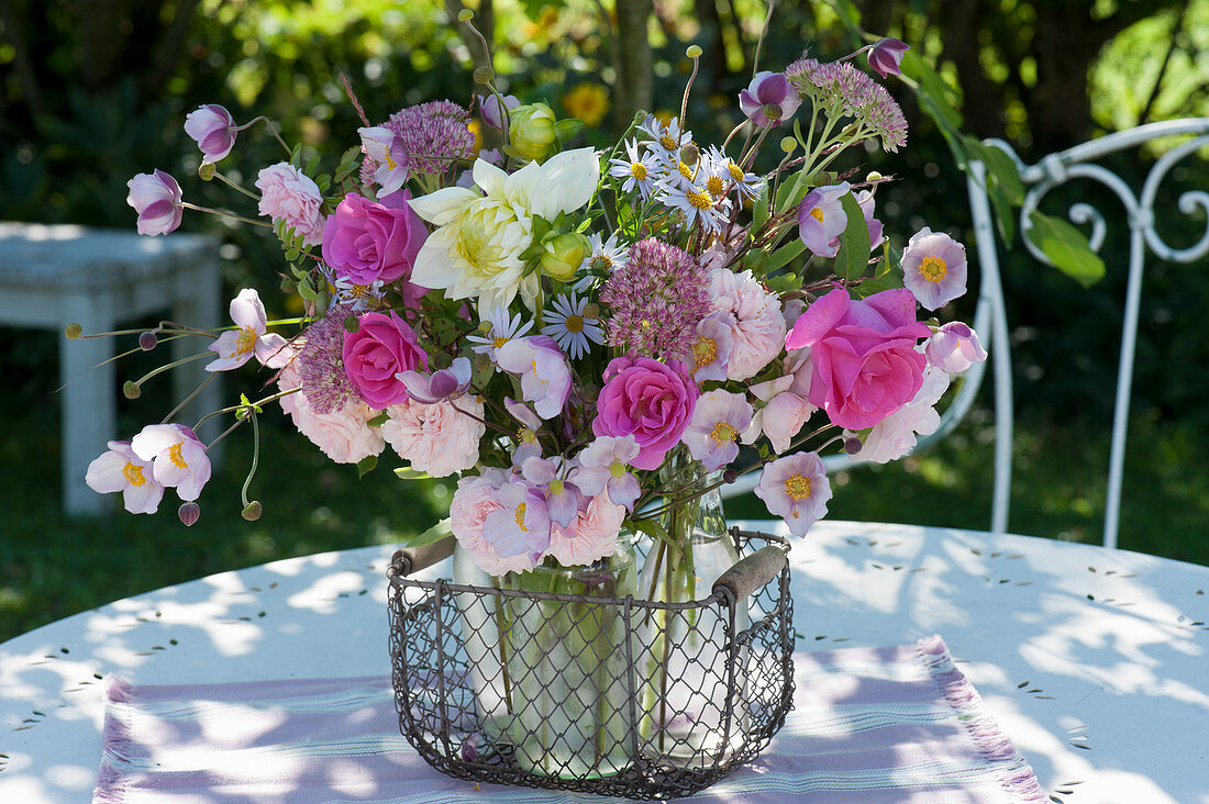 Late summer bouquet with roses, autumn anemone, stonecrop, dahlia, and aster