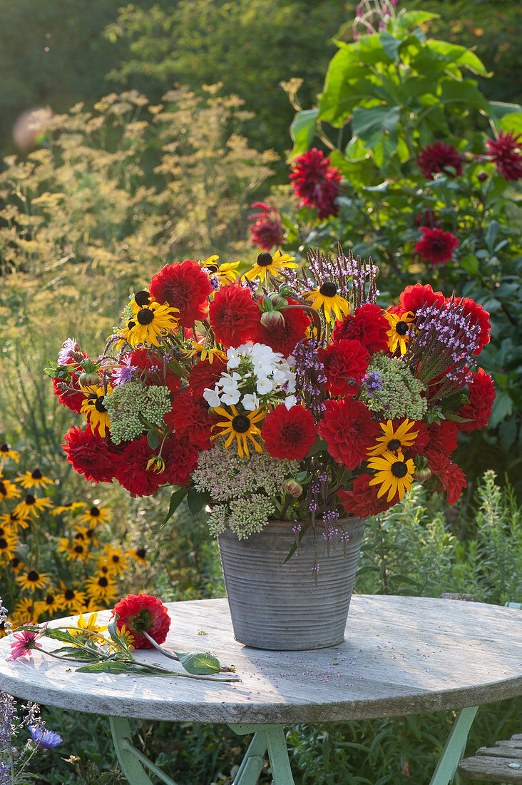 Lush bouquet from the cottage garden: dahlias, coneflowers, flame flower, sedum, and verbena