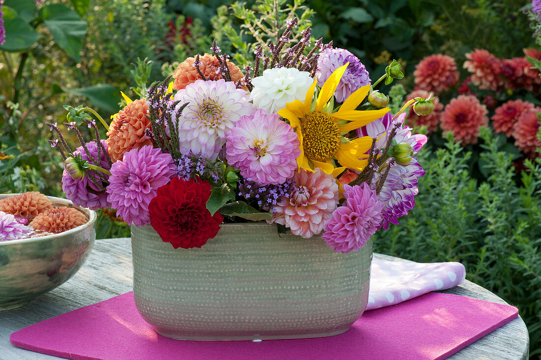 Arrangement of dahlias, sunflower and verbena