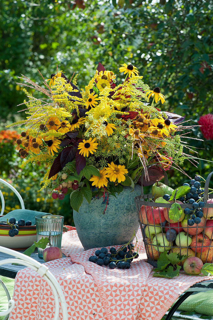 Autumn bouquet of sun hat, sun bride, sun eye, fennel, goldenrod and Chinese reed flowers