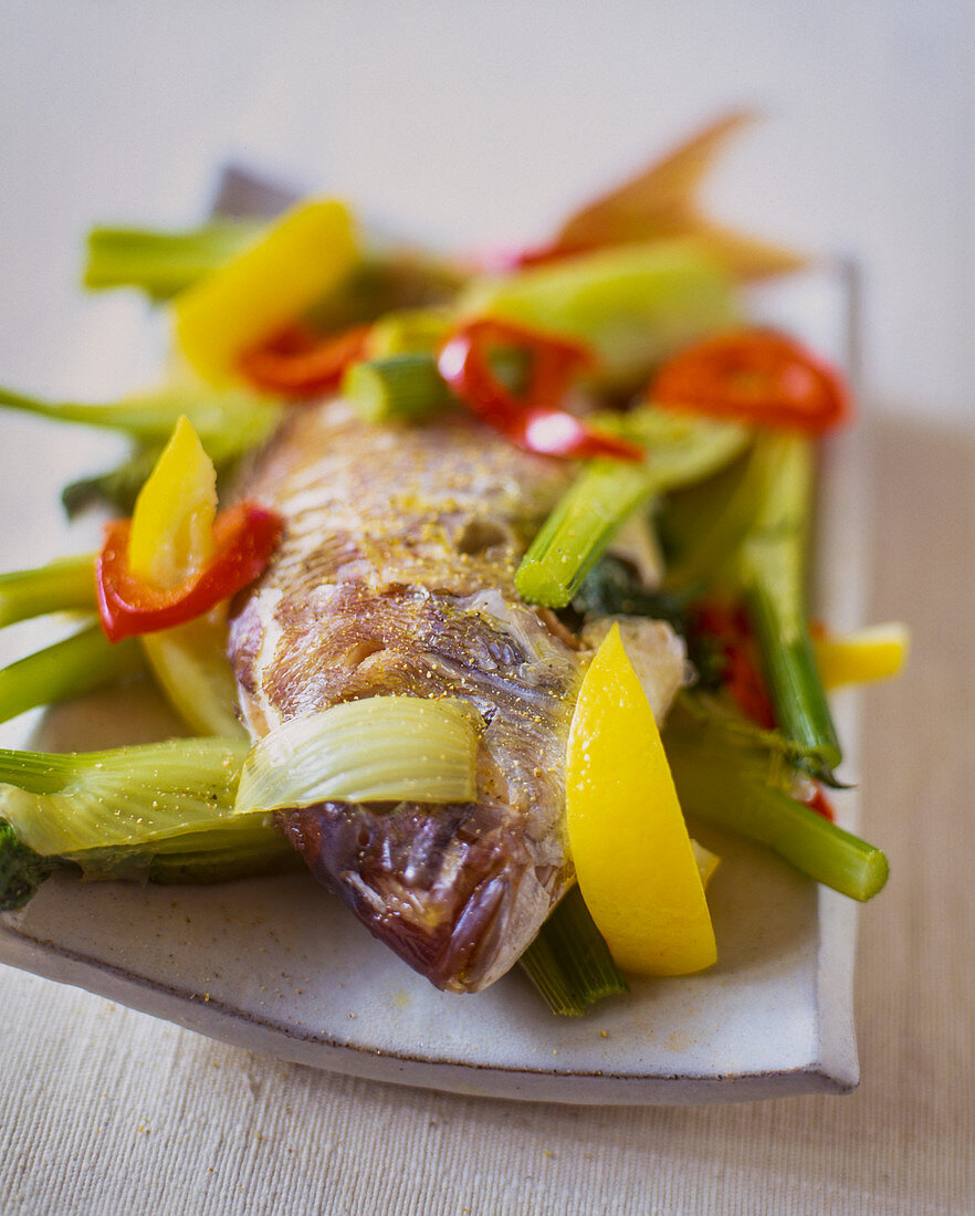 Fried merlan with vegetables