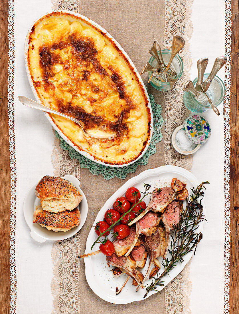 Roasted lamb with potato gratin and tomatoes