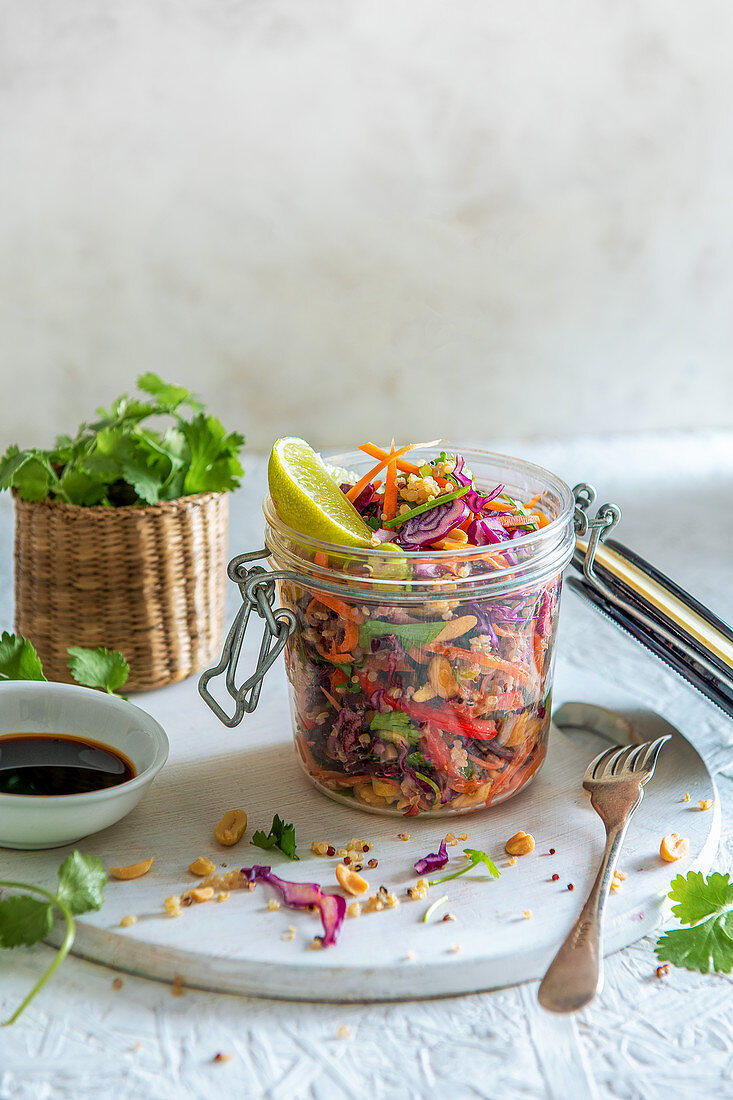 Crunchy salad with shredded cabbage, spring onion, carrots, coriander, quinoa with paenut and lime soy dressing