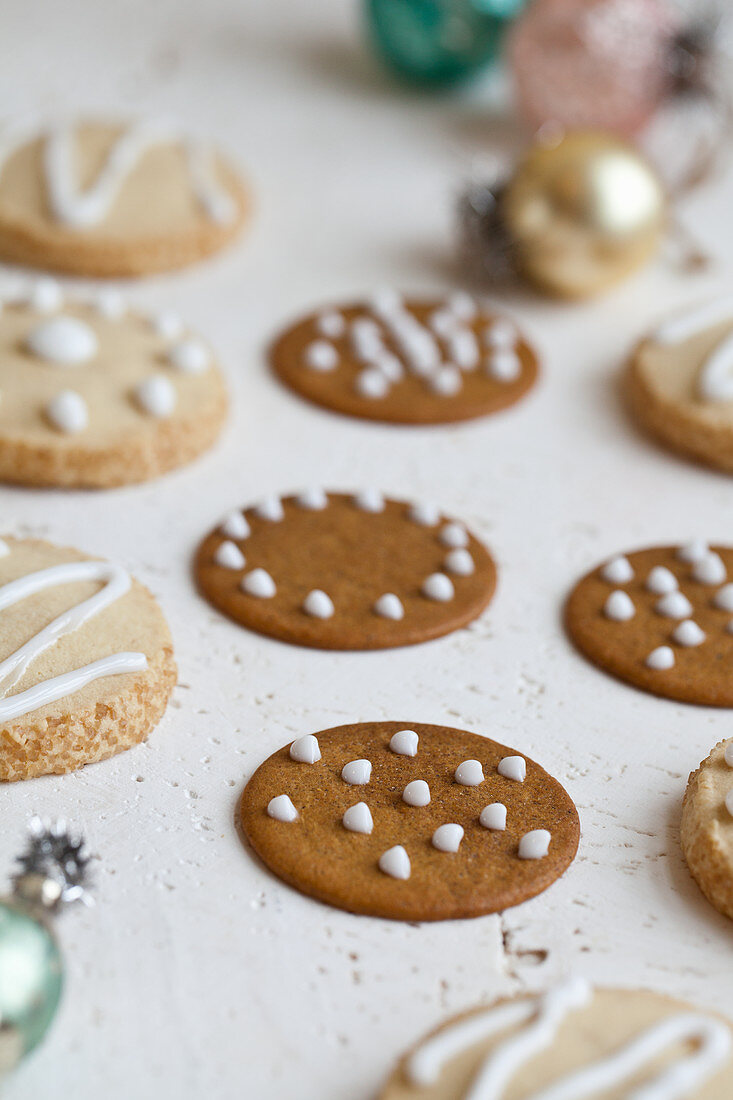 Ginger cookies with white icing and holiday ornaments