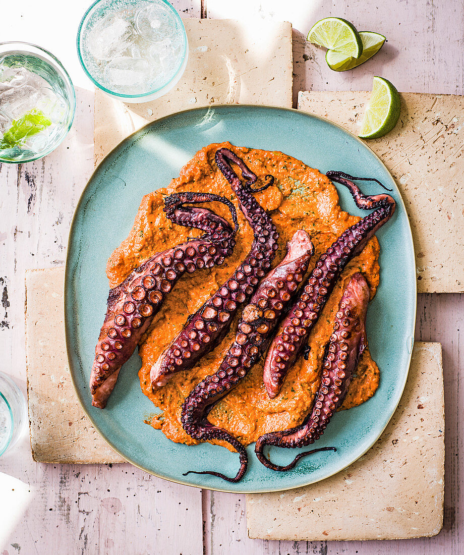 Charred octopus with chilli and lime romesco sauce