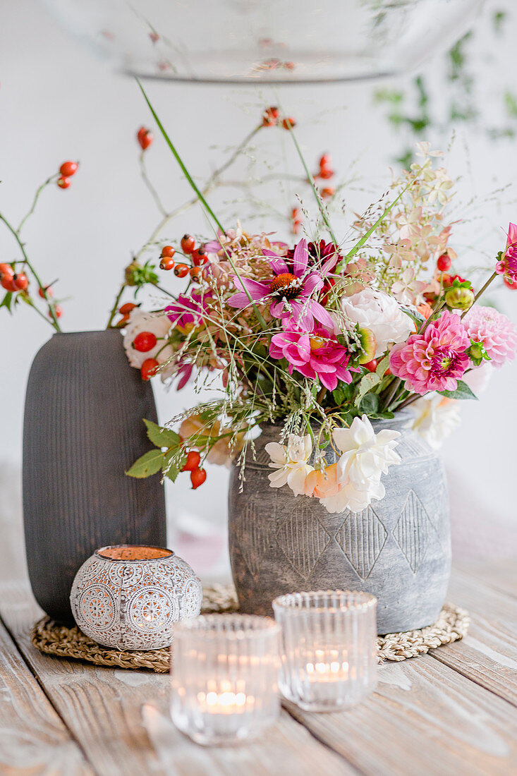 Autumnal bouquet with dahlias, roses, rose hips and grasses