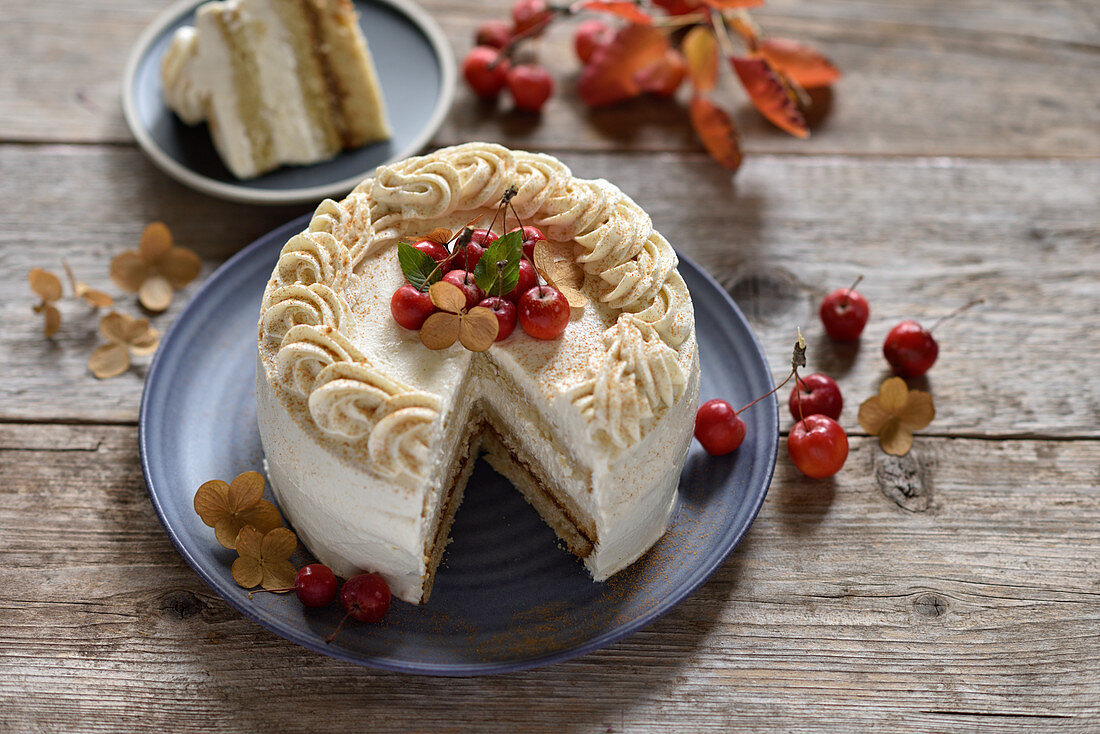 Vegan apple and almond cream cake with date caramel and mini apples, sliced