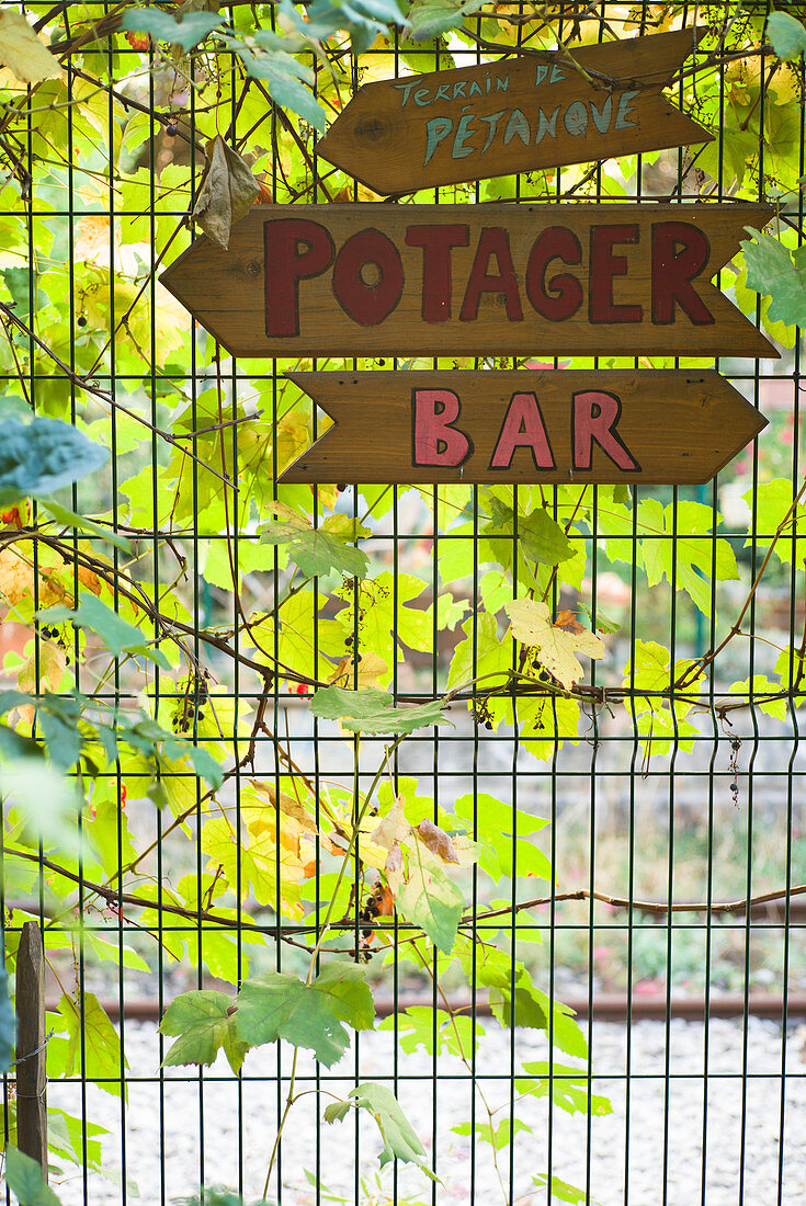 Signposts on a fence, Paris, France