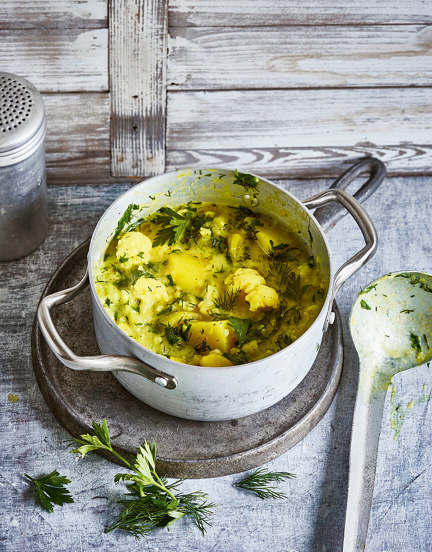 Potato and cauliflower stew with coconut milk and dill