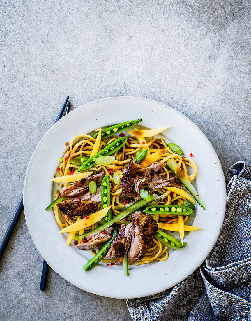 Crispy duck, cucumber and mango noodle salad with sesame and hoisin dressing