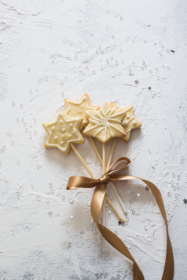Star cookies on a stick, tied together with ribbon
