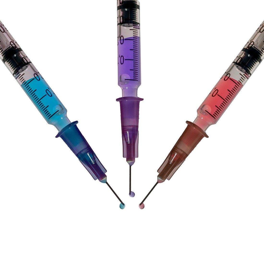 Hypodermic syringes filled with colourful liquid