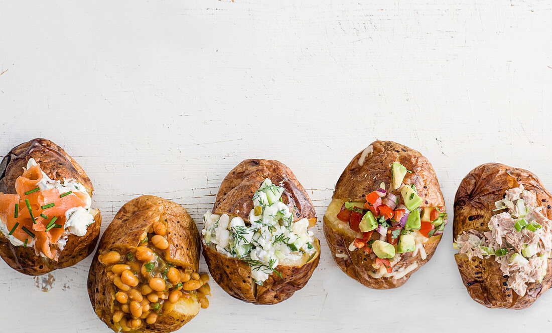 Smart Jacket potatoes with salmon, beans, cheese, avocado and tuna crunch