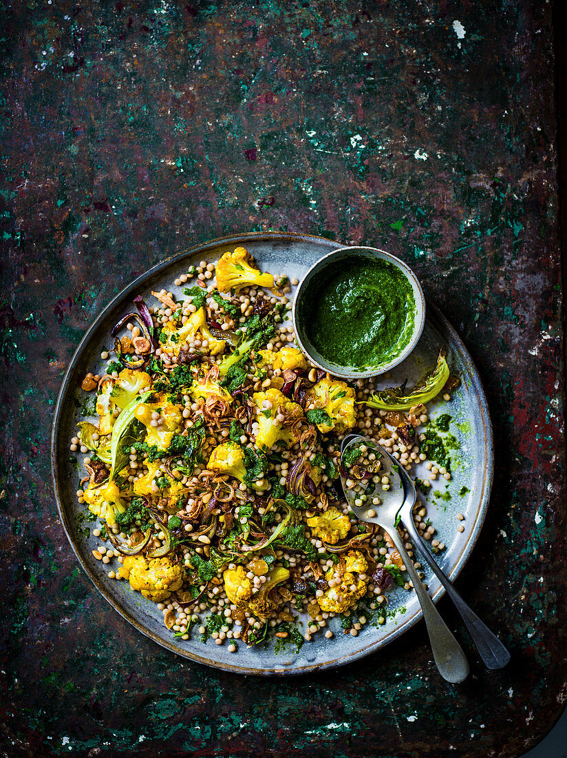 Roasted cauliflower and couscous salad with zhoug and crispy shallots