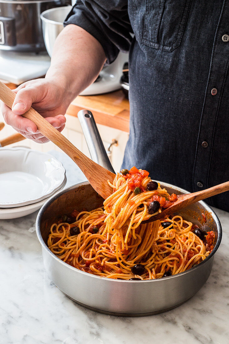 Man with pasta puttanesca