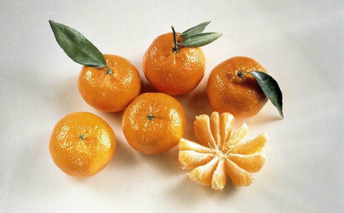 Peeled and Sectioned Tangerine; Whole Tangerines