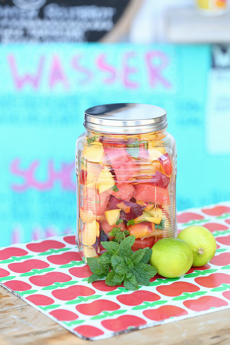 Water with fruit in a screw-top jar