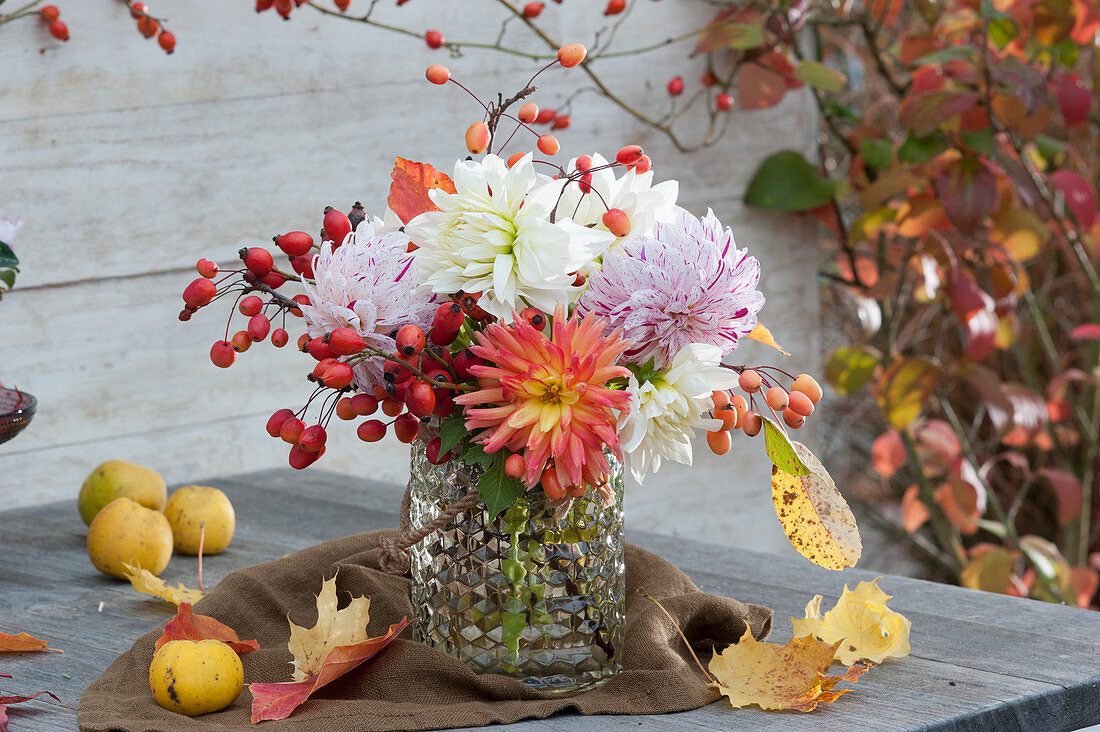 Bouquet of dahlias, rose hips and ornamental apples
