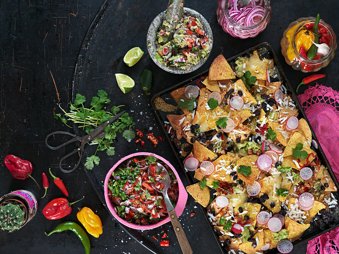 Texmex roasted nachos with chilli, coriander, lime, pickled red onion, radish, black beans and cheese