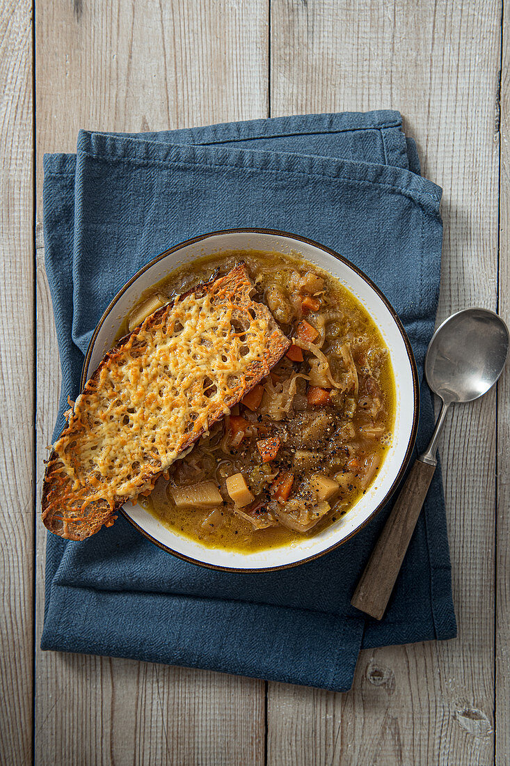 Onion and vegetable soup with toasted cheese sourdough bread