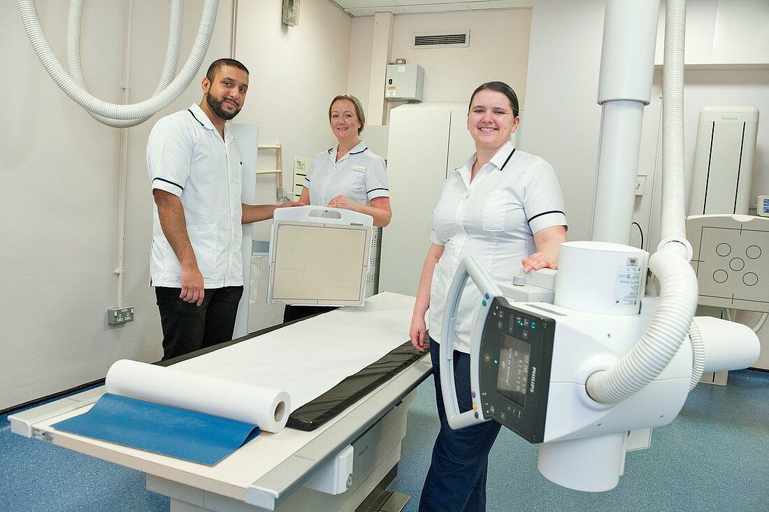 Radiographers with an X-ray machine