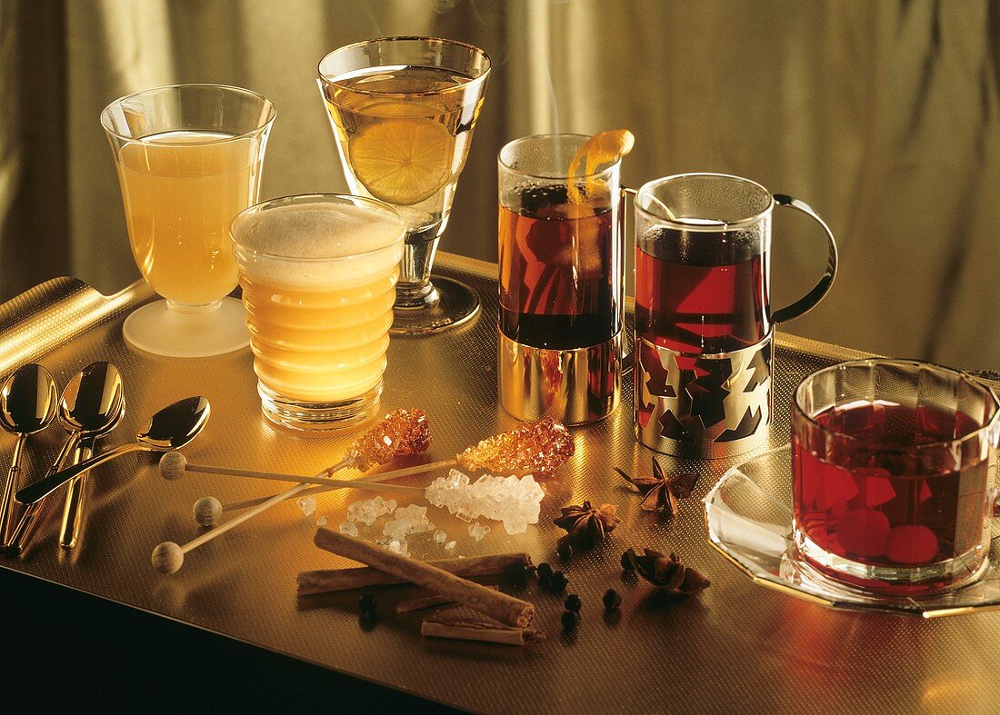 Various types of punch in glasses on a tray
