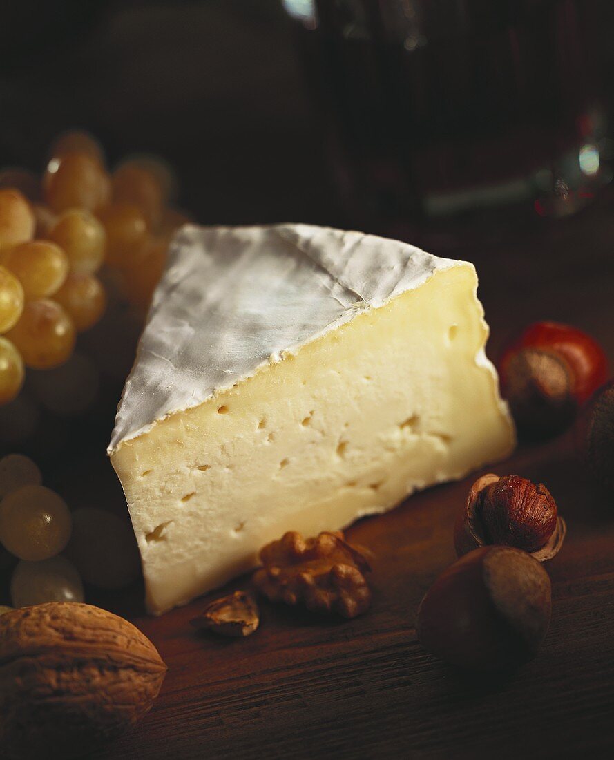 A Wedge of Camembert Cheese with Nuts