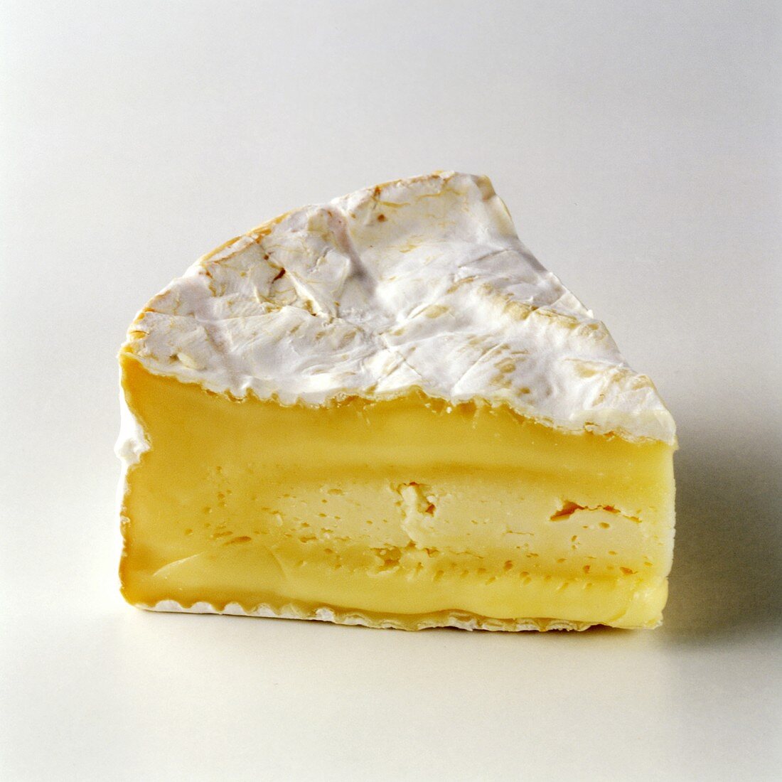 A Single Wedge of Camembert Cheese