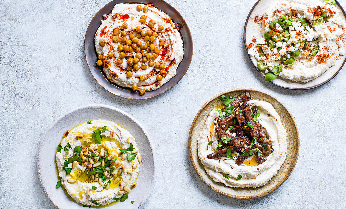 Hummus: Harissa and yogurt swirl, Olive, feta and smoked paprika, Toasted pine nuts and lemon, Spicy lamb