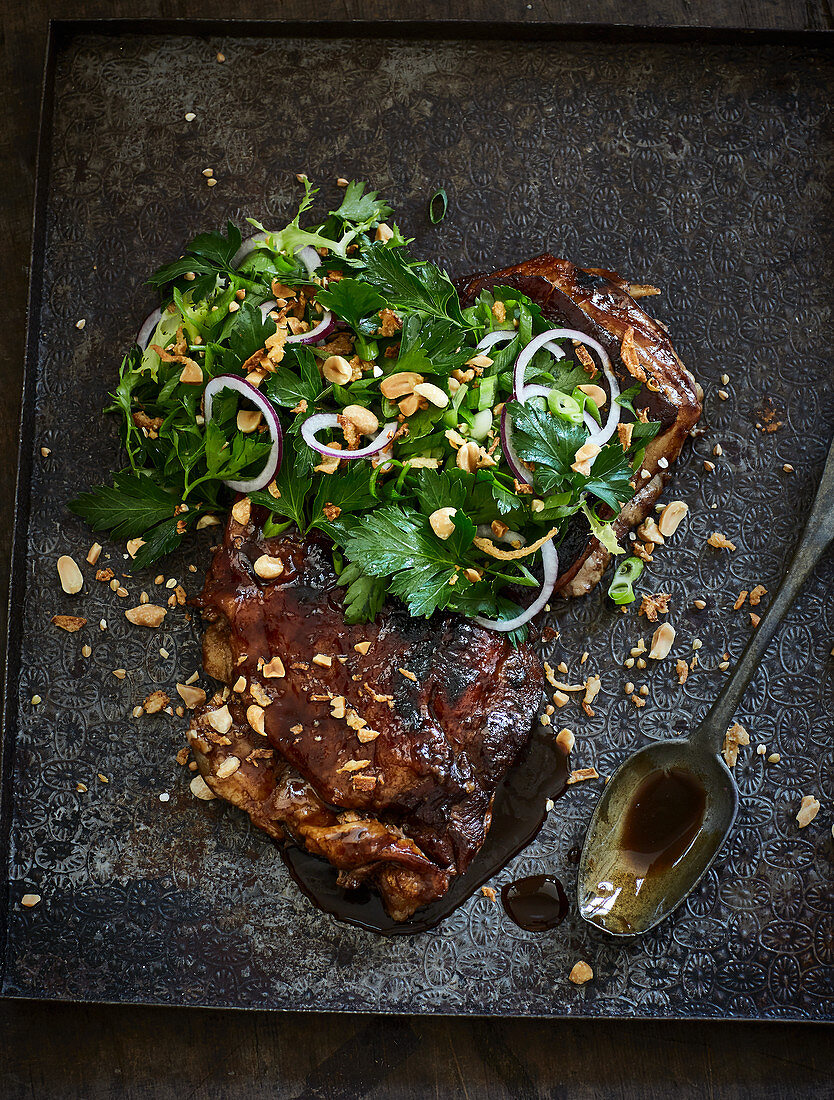 Cola-glazed lamb ribs with a spring onion salad and crunchy buckwheat