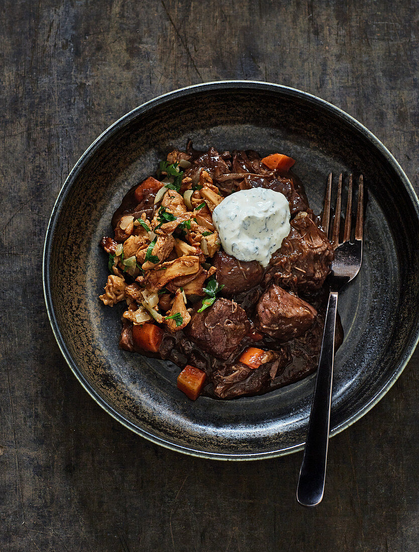 Braised leg of venison with chanterelle mushrooms and herb cream cheese