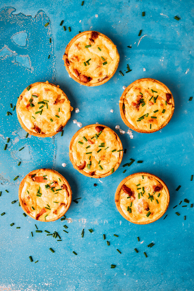 Mini cheese and bacon tarts with chives