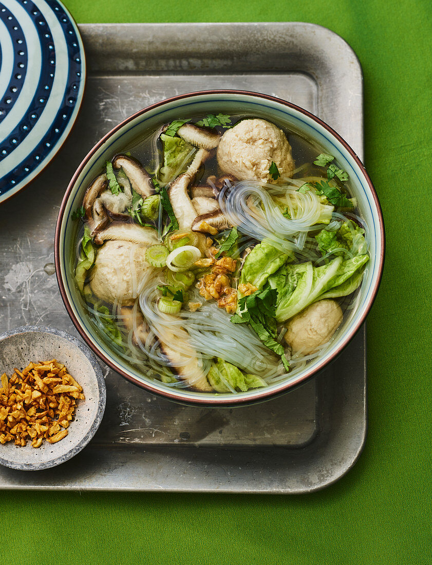 Thai glass noodle soup with mushrooms and meatballs
