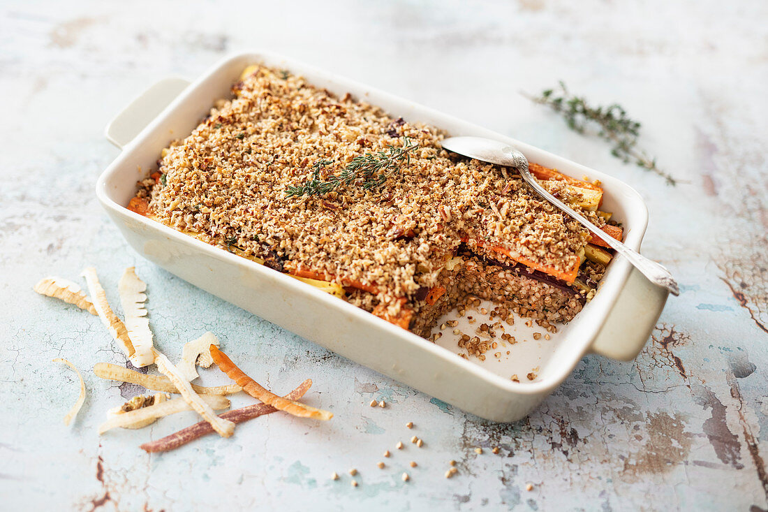 Bake with buckwheat, root vegetables and pecan-parmesan crust