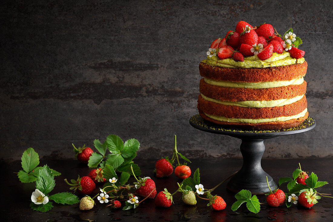 Pistachio tiramisu cake with fresh strawberries