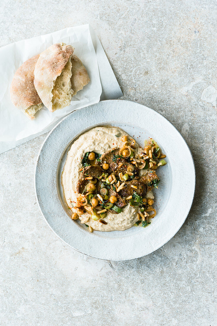 Warm hummus with lamb and a herb sauce (Israel)