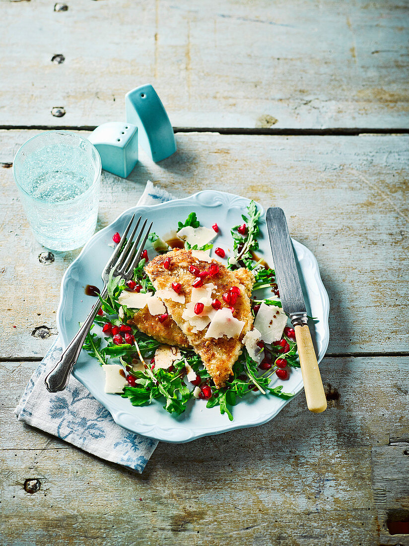 Turkey schnitzel with rocket and pomegranate salad