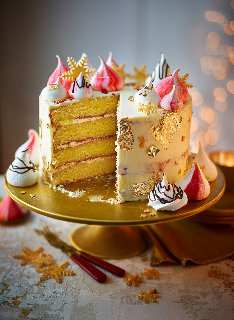 White chocolate, orange and cranberry cake with slice out