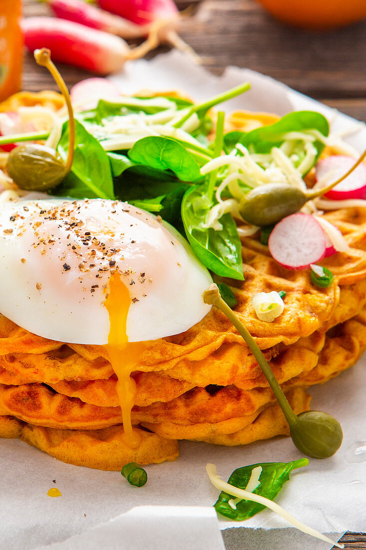 Savoury waffles with cheese, spinach and poached egg