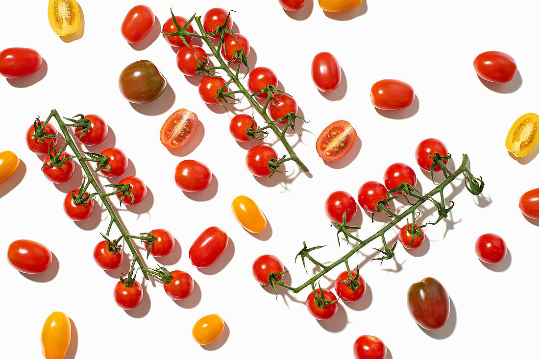 Healthy colorful cherry tomatoes on white background